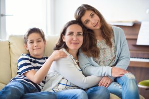 Family sitting on a coach